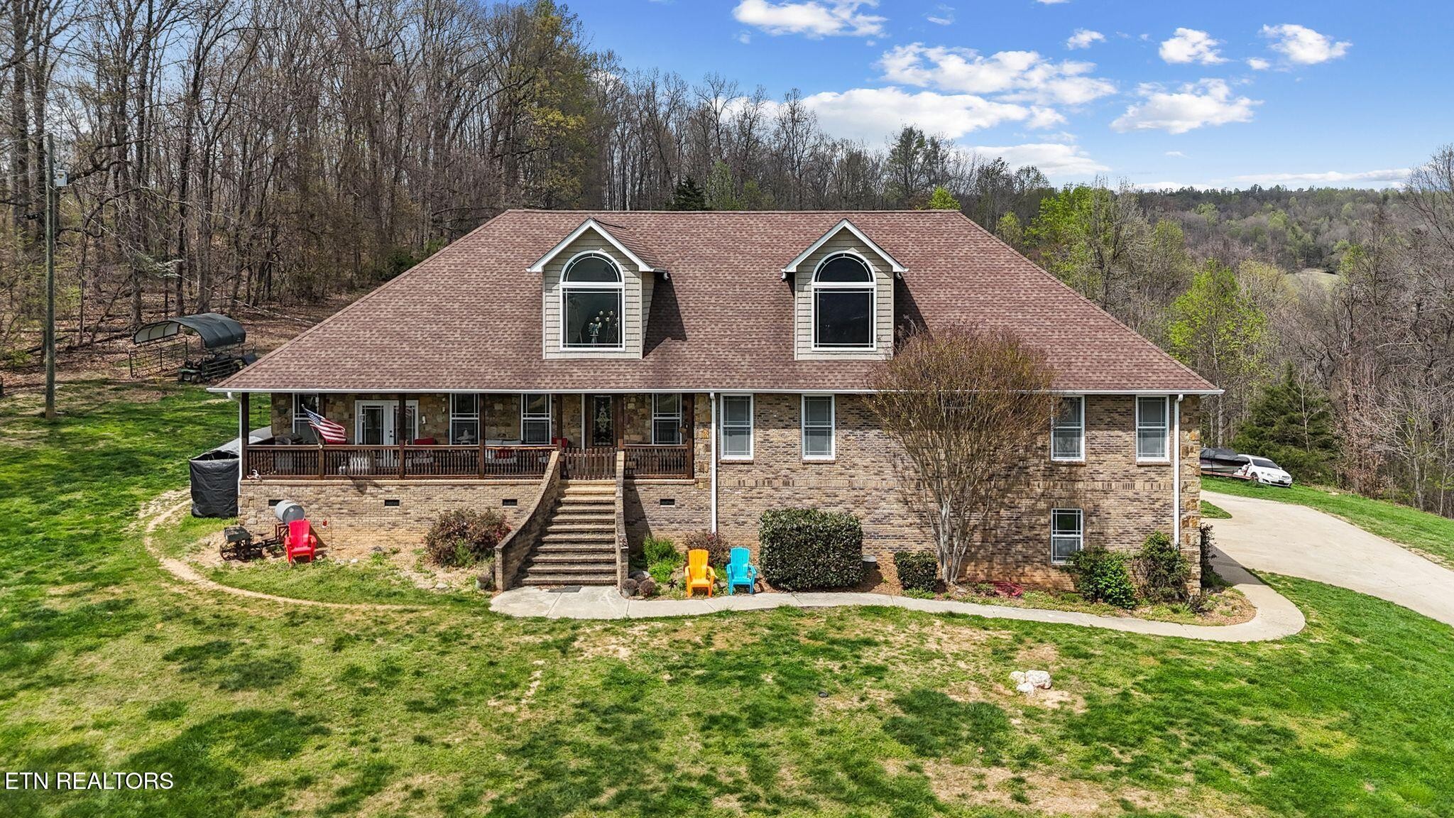 741 Clinch Valley Road Powder Springs, TN 37848 - Photo 4 of 50 a front view of a house with a yard