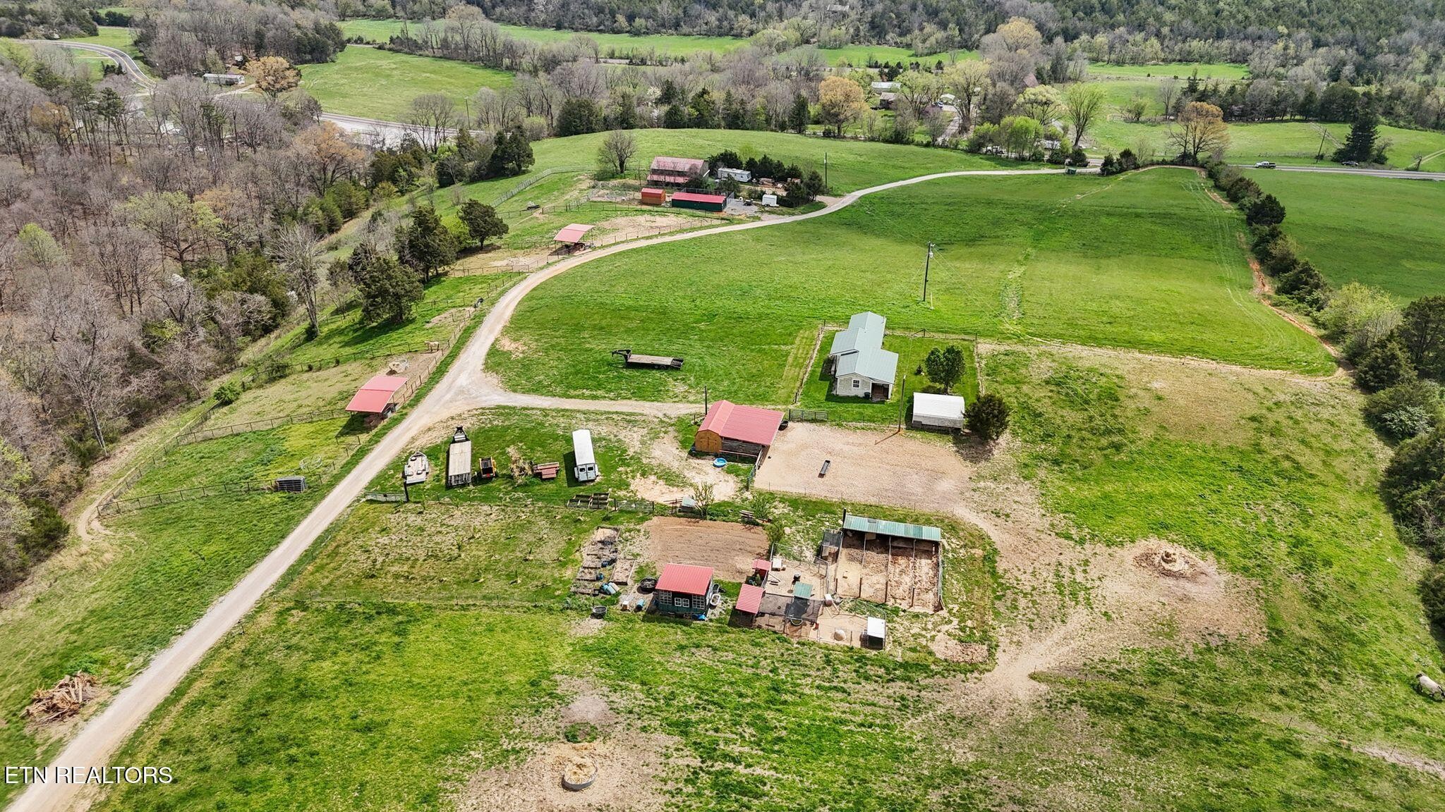 741 Clinch Valley Road Powder Springs, TN 37848 - Photo 41 of 50 an aerial view of a house with a garden and trees