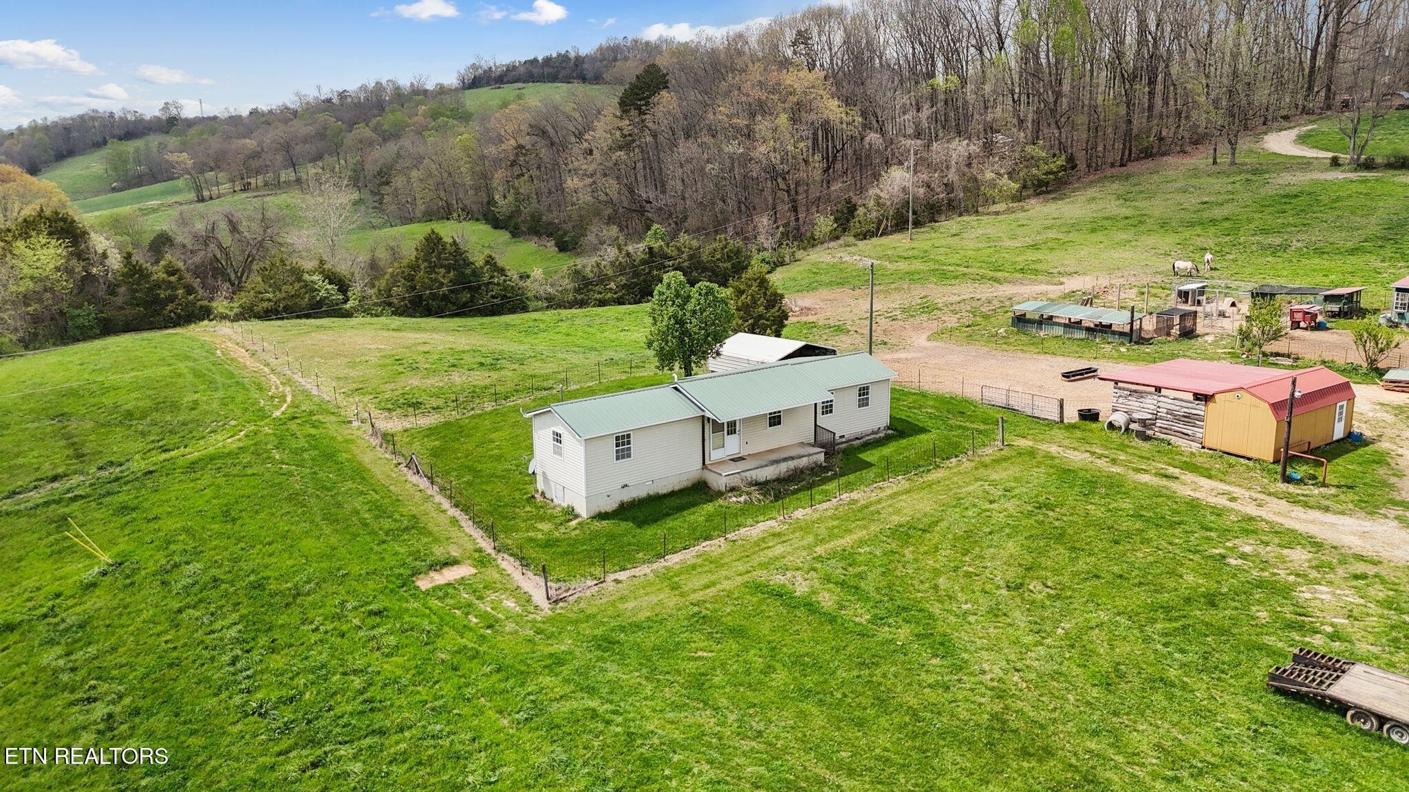 741 Clinch Valley Road Powder Springs, TN 37848 - Photo 42 of 50 a view of a garden with an outdoor space