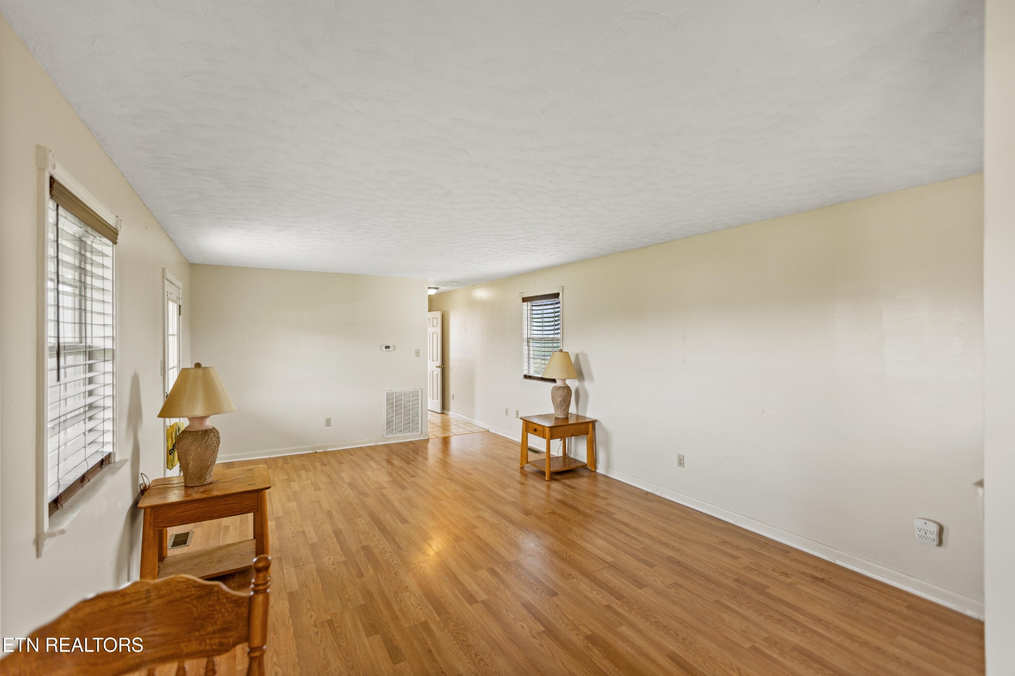 741 Clinch Valley Road Powder Springs, TN 37848 - Photo 43 of 50 a view of a room with gym equipment and wooden floor