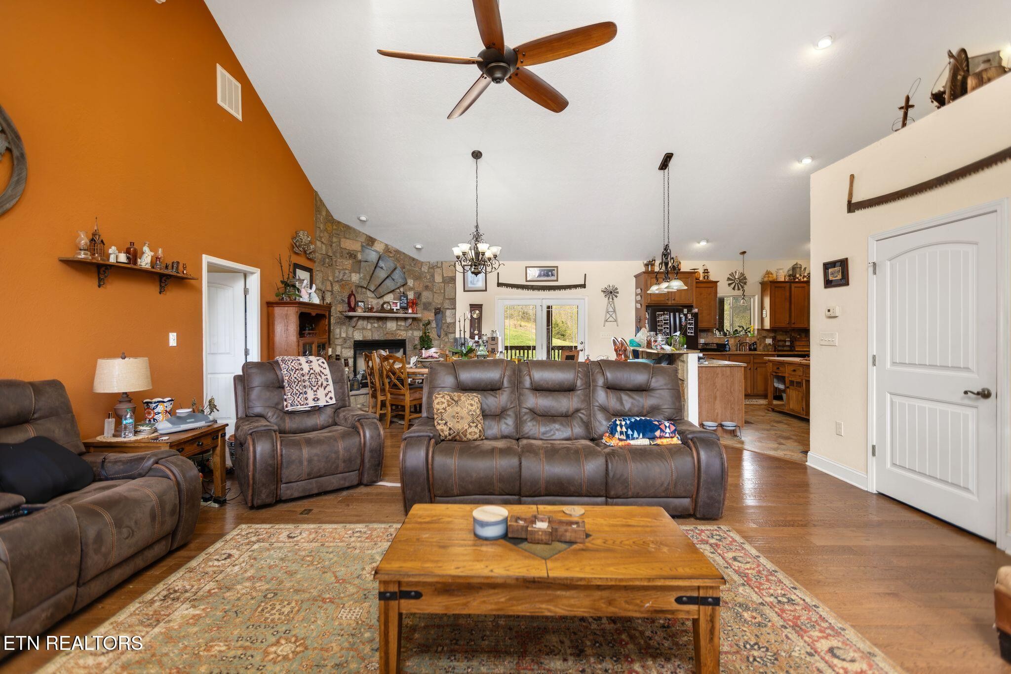 741 Clinch Valley Road Powder Springs, TN 37848 - Photo 6 of 50 a living room with furniture and a chandelier