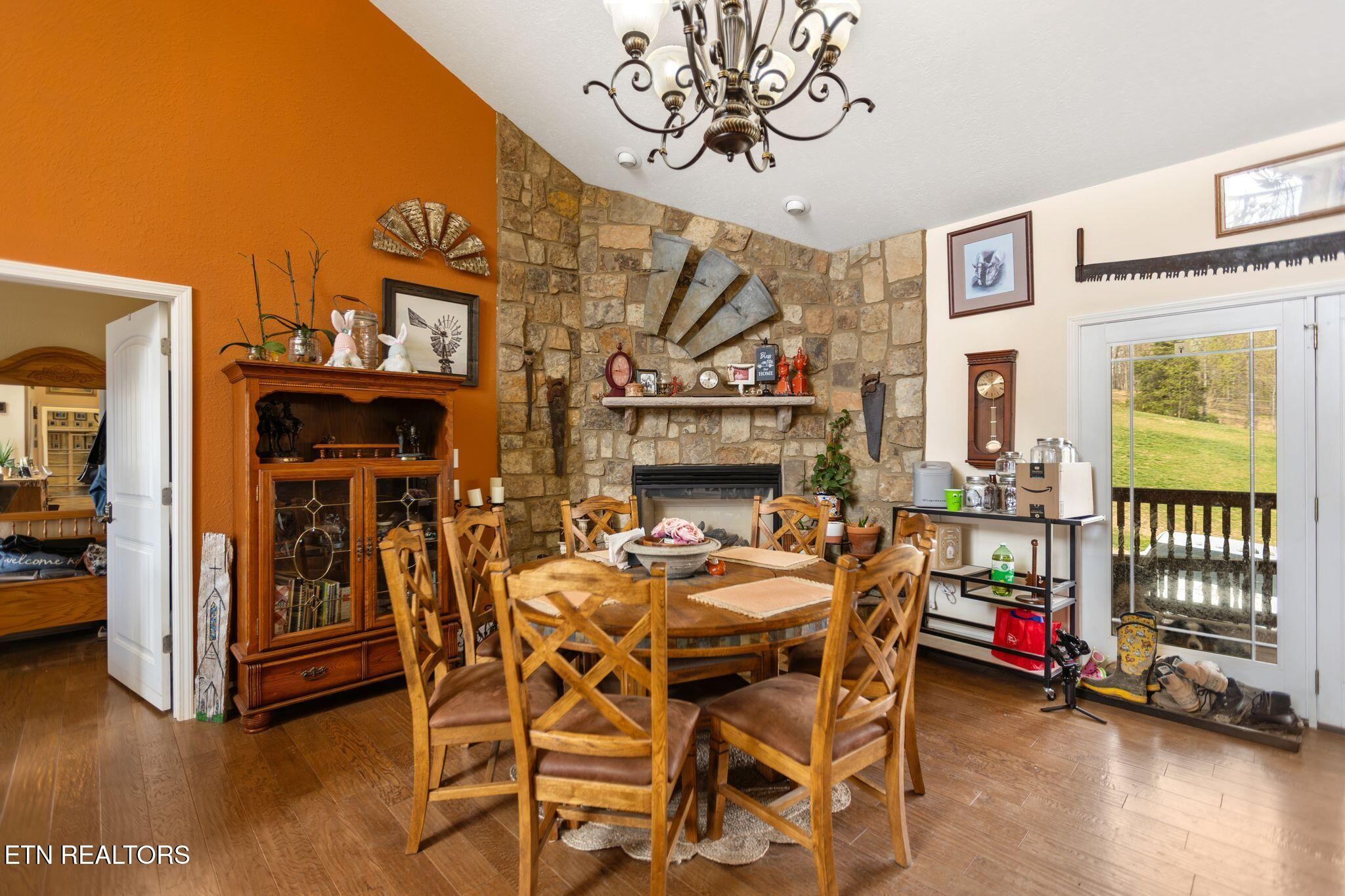741 Clinch Valley Road Powder Springs, TN 37848 - Photo 7 of 50 a view of a dining room with furniture and wooden floor