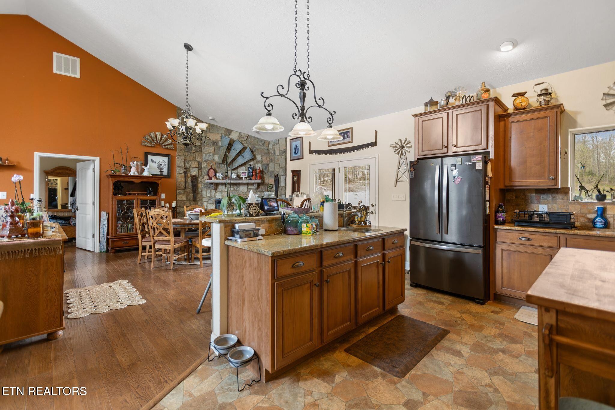 741 Clinch Valley Road Powder Springs, TN 37848 - Photo 8 of 50 a kitchen with refrigerator and cabinets