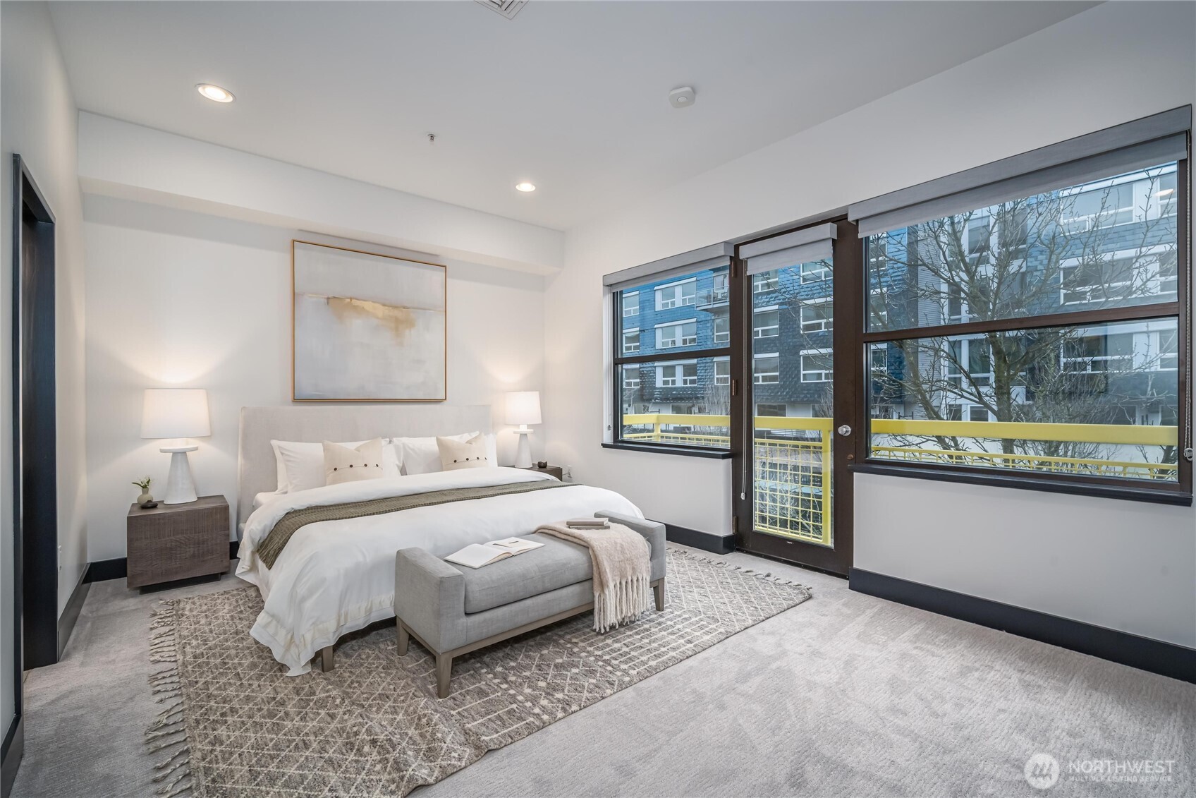 615 East Pike Street, Unit 303 Seattle, WA 98122 - Photo 13 of 40 a bedroom with a large bed and a large window