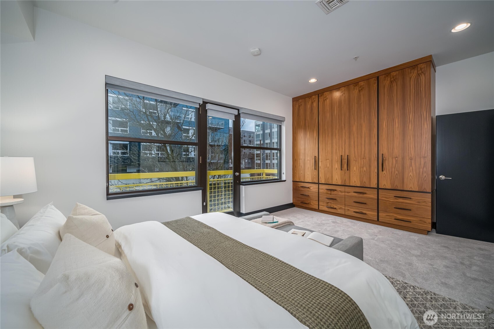 615 East Pike Street, Unit 303 Seattle, WA 98122 - Photo 15 of 40 a bedroom with a large bed and a large window