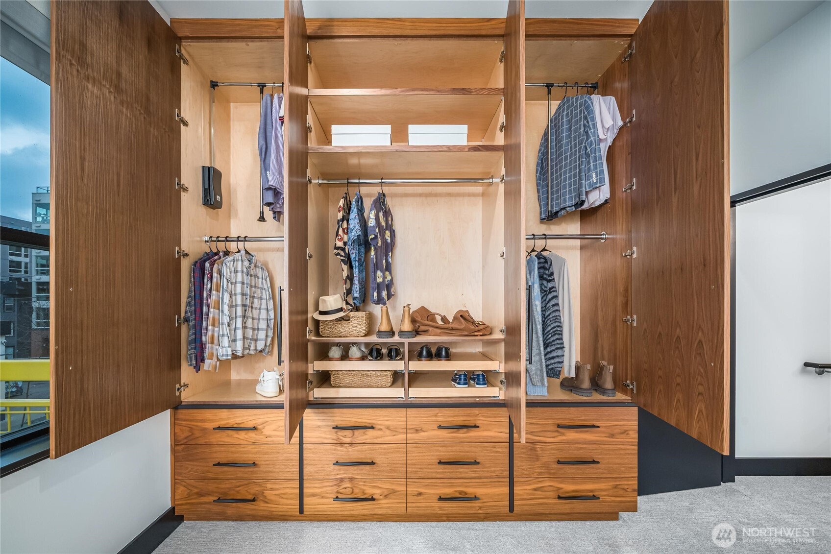 615 East Pike Street, Unit 303 Seattle, WA 98122 - Photo 16 of 40 a view of walk in closet with clothes