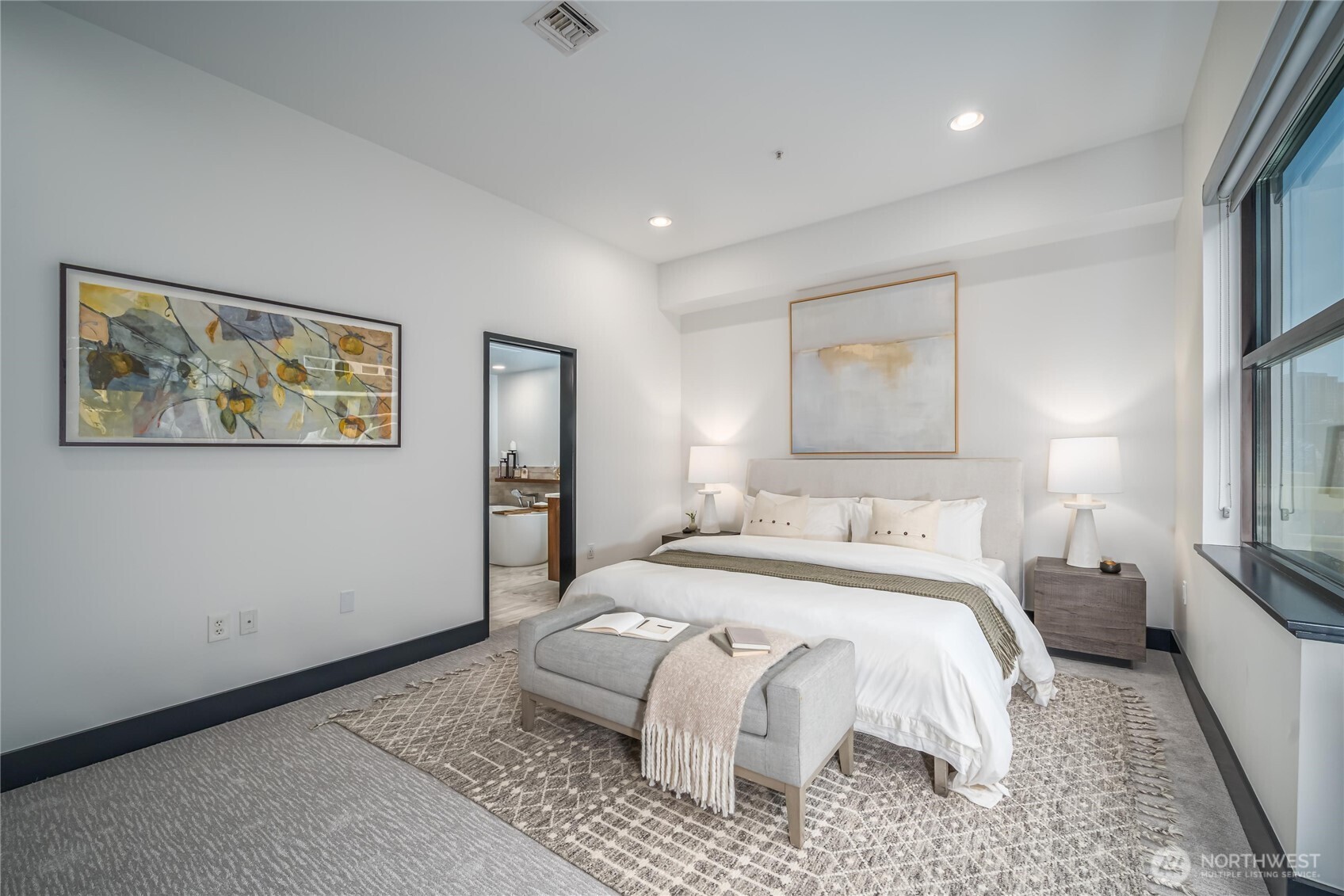 615 East Pike Street, Unit 303 Seattle, WA 98122 - Photo 17 of 40 a bed room with a bed and a painting