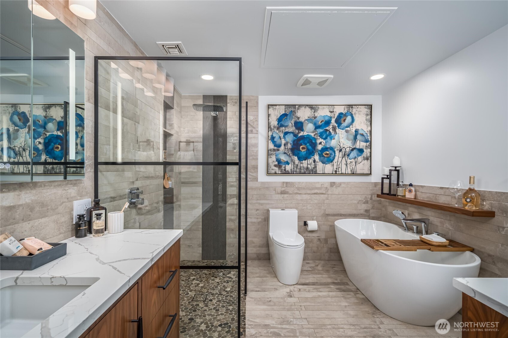 615 East Pike Street, Unit 303 Seattle, WA 98122 - Photo 18 of 40 a bathroom with a granite countertop sink a toilet a mirror and shower