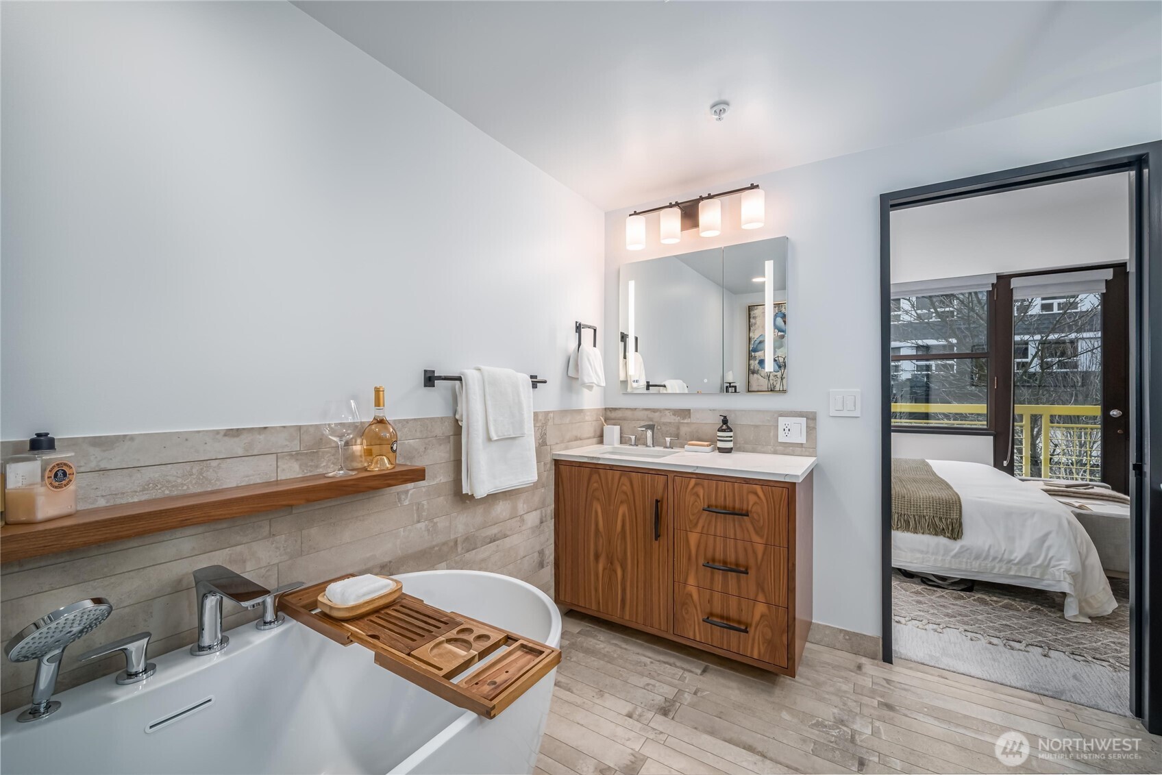 615 East Pike Street, Unit 303 Seattle, WA 98122 - Photo 22 of 40 a spacious bathroom with a double vanity sink and a mirror