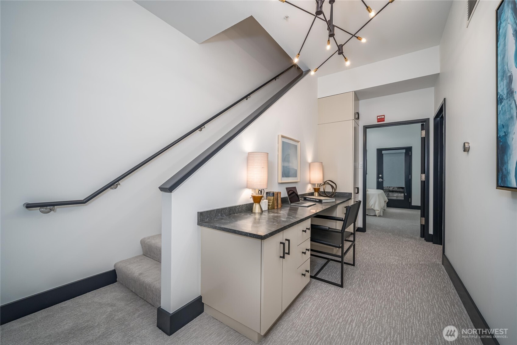 615 East Pike Street, Unit 303 Seattle, WA 98122 - Photo 24 of 40 a living room with furniture and a clock
