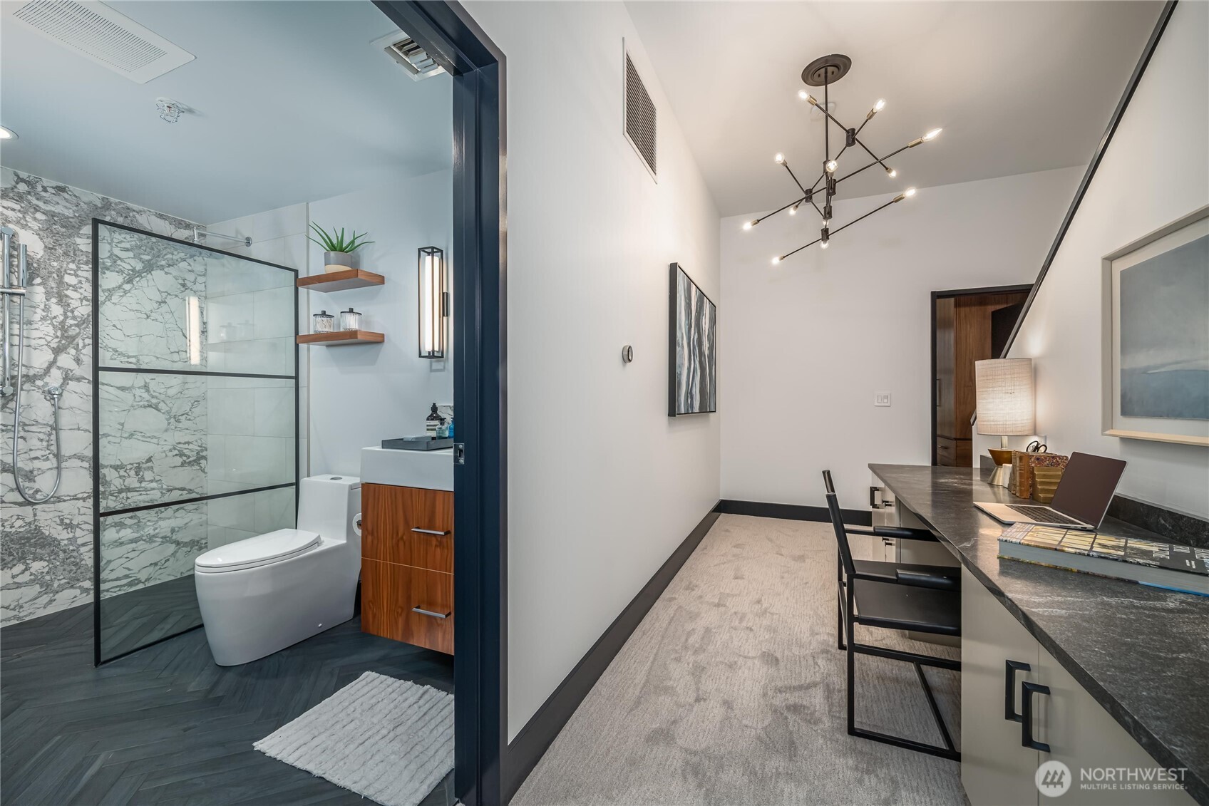615 East Pike Street, Unit 303 Seattle, WA 98122 - Photo 30 of 40 a spacious bathroom with a toilet a sink and bathtub