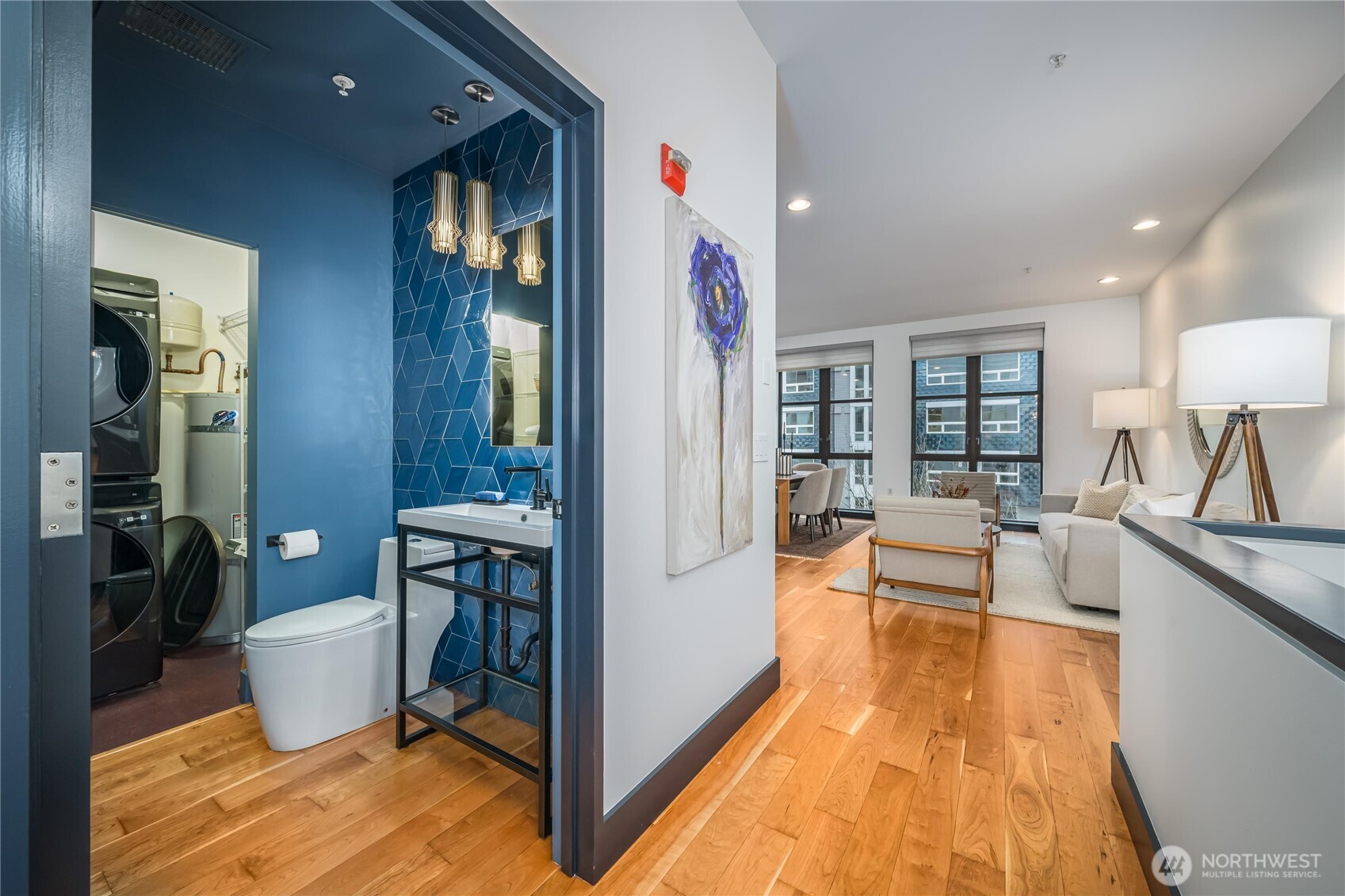 615 East Pike Street, Unit 303 Seattle, WA 98122 - Photo 3 of 40 a living room with furniture and a wooden floor