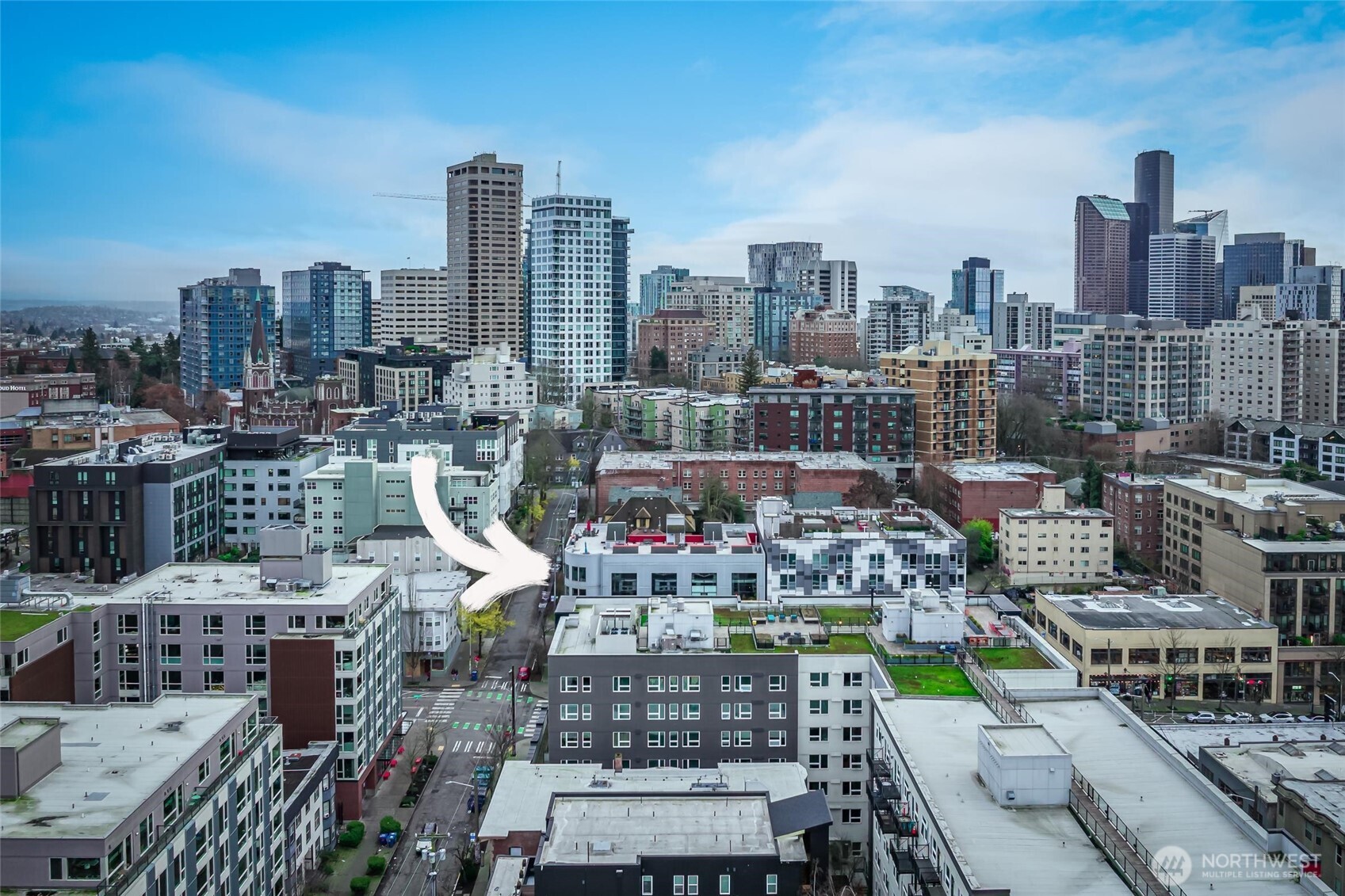 615 East Pike Street, Unit 303 Seattle, WA 98122 - Photo 34 of 40 a city view with tall buildings