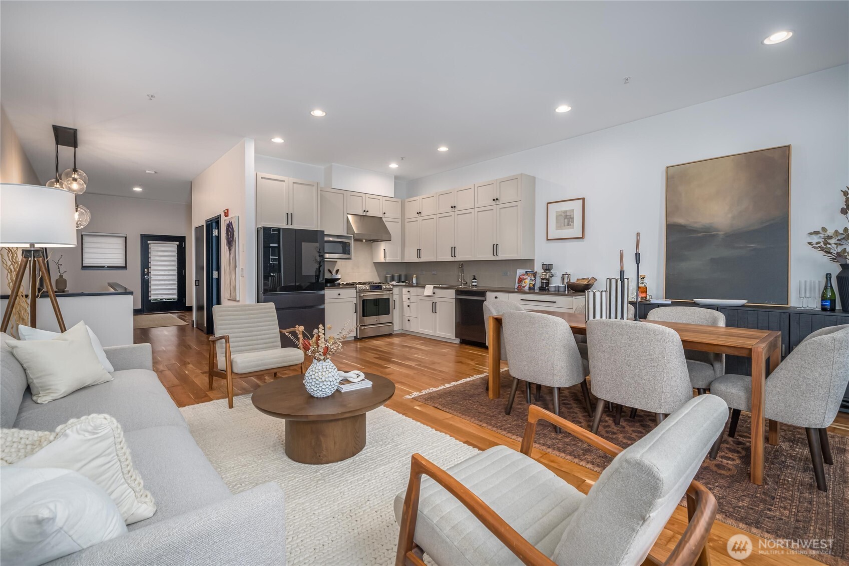 615 East Pike Street, Unit 303 Seattle, WA 98122 - Photo 4 of 40 a living room with lots of furniture and view of kitchen