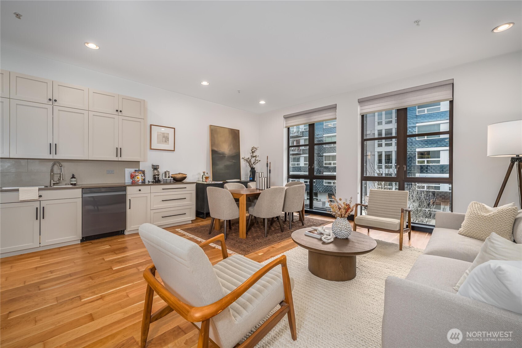 615 East Pike Street, Unit 303 Seattle, WA 98122 - Photo 5 of 40 a living room with furniture kitchen view and a large window