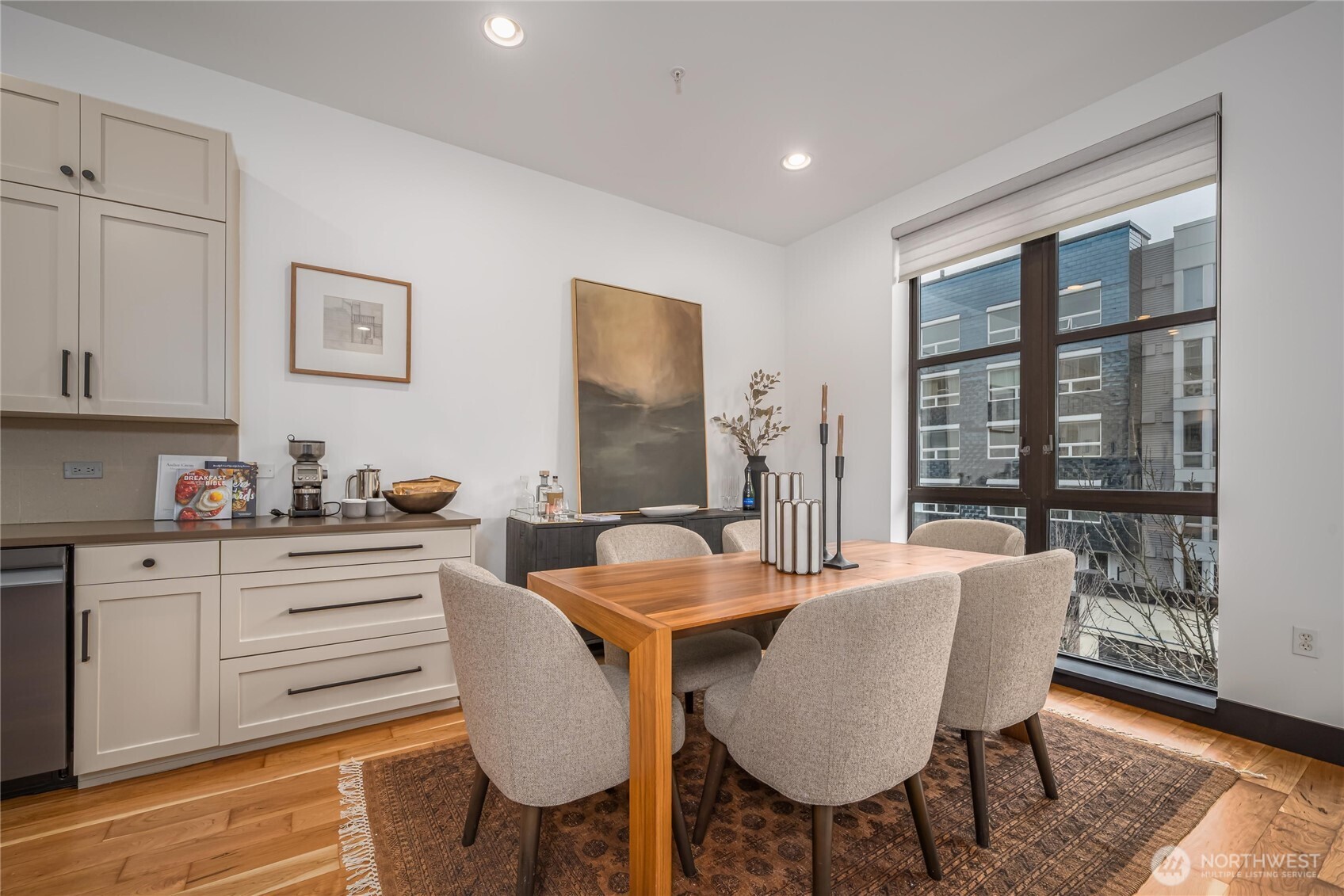 615 East Pike Street, Unit 303 Seattle, WA 98122 - Photo 7 of 40 a view of a dining room with furniture window and wooden floor