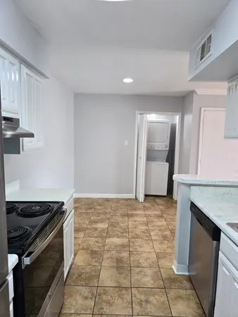 a view of an empty room with a fireplace