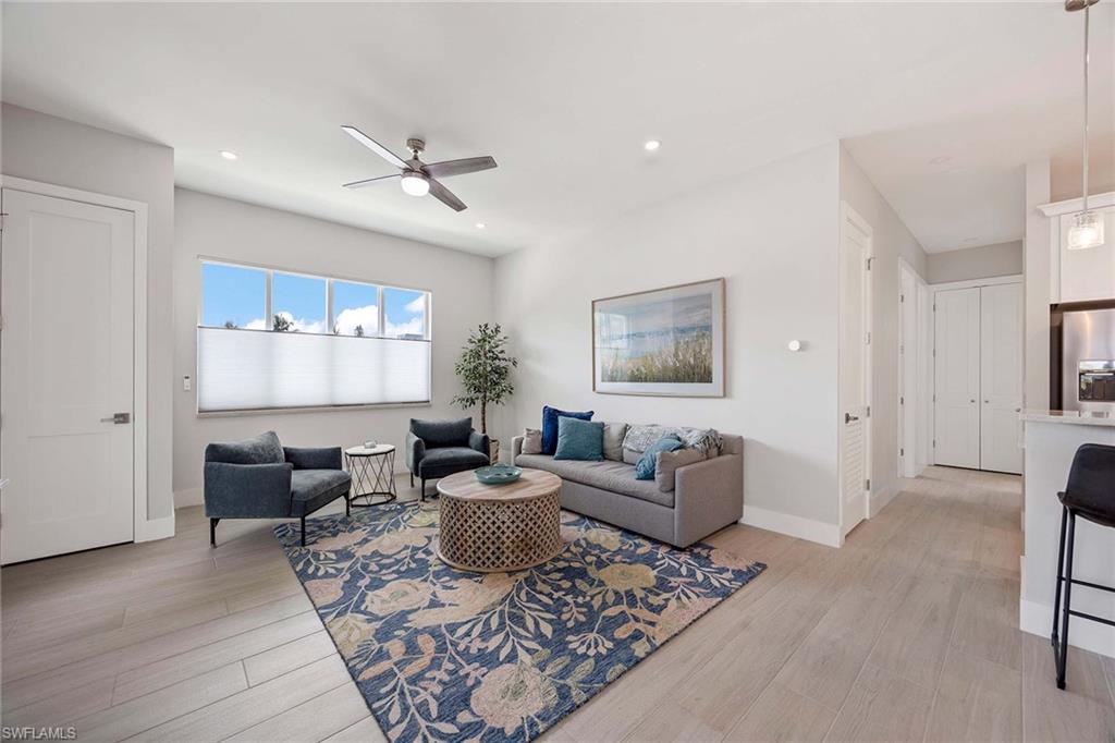 1395 Curlew Avenue, Unit 43 Naples, FL 34102 - Photo 2 of 24 a living room with furniture or couch and a wooden floor