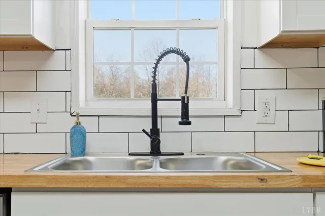 a kitchen with a sink and a window