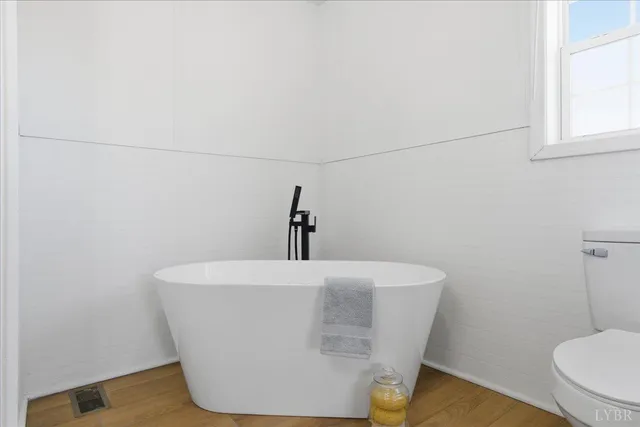 a white bath tub sitting in a bathroom