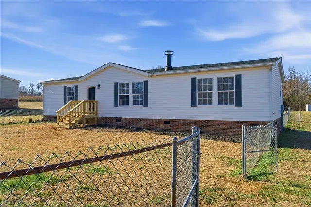 a front view of a house with basket ball court
