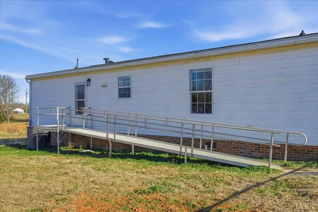 a view of a house with a backyard