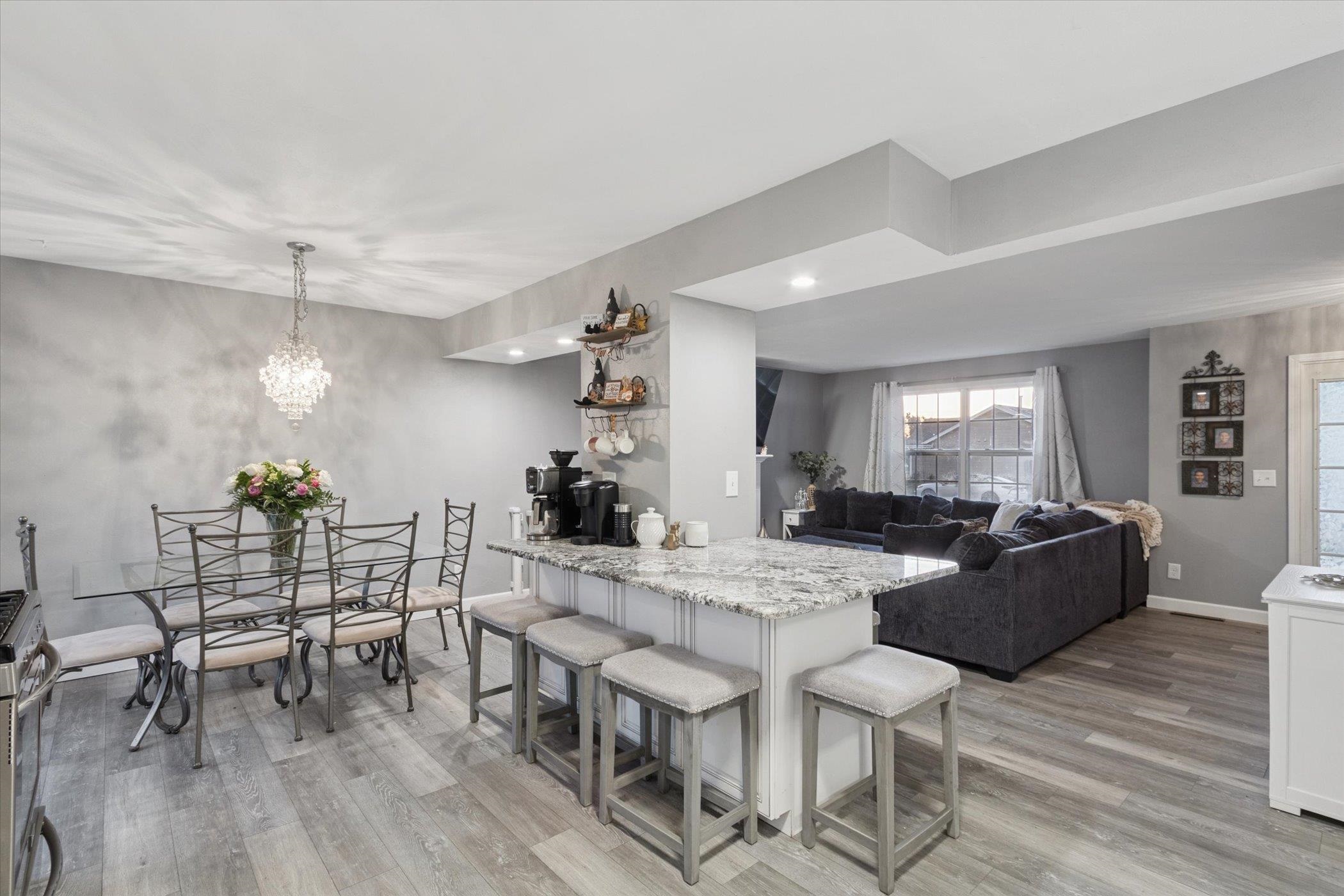 549 Bayfield Road Rockton, IL 61073 - Photo 13 of 47 a view of a dining room with furniture and wooden floor