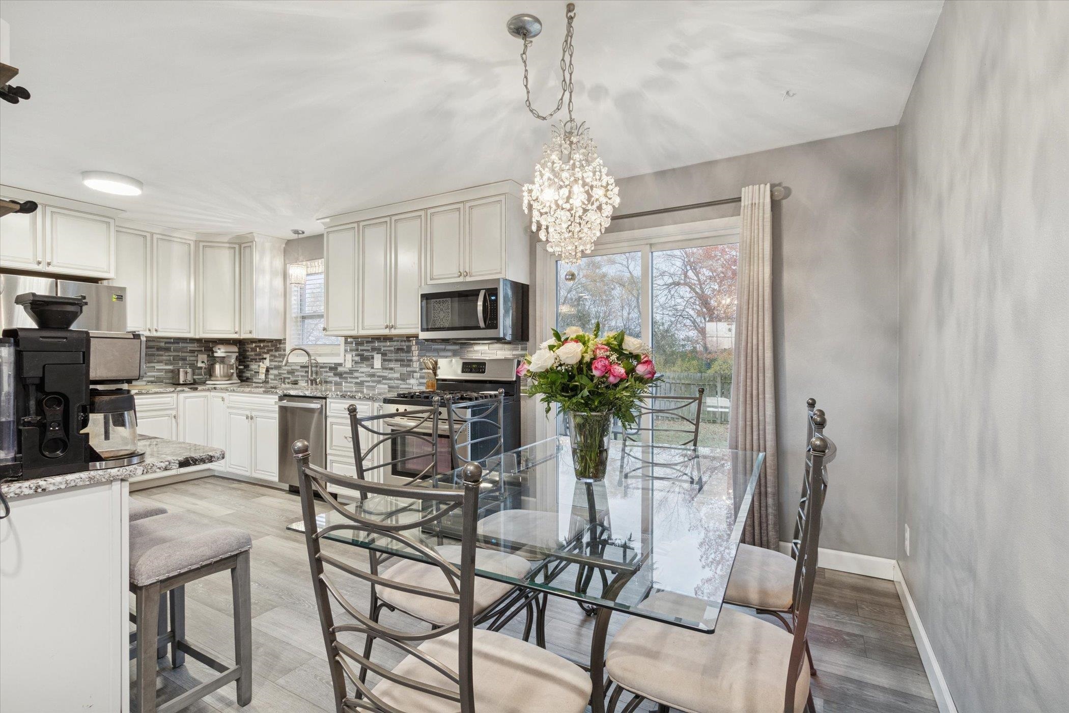 549 Bayfield Road Rockton, IL 61073 - Photo 16 of 47 a view of a dining room with furniture and chandelier