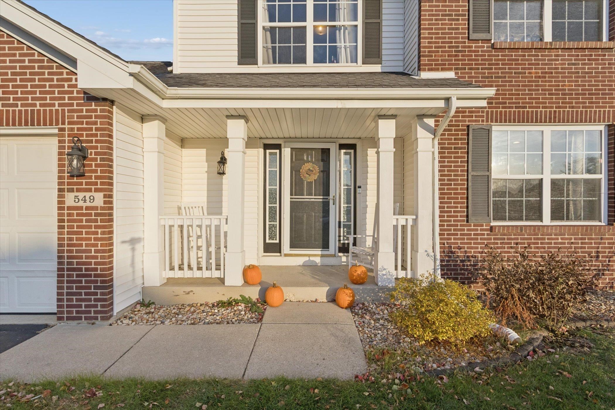 549 Bayfield Road Rockton, IL 61073 - Photo 2 of 47 a view of a brick house with many windows