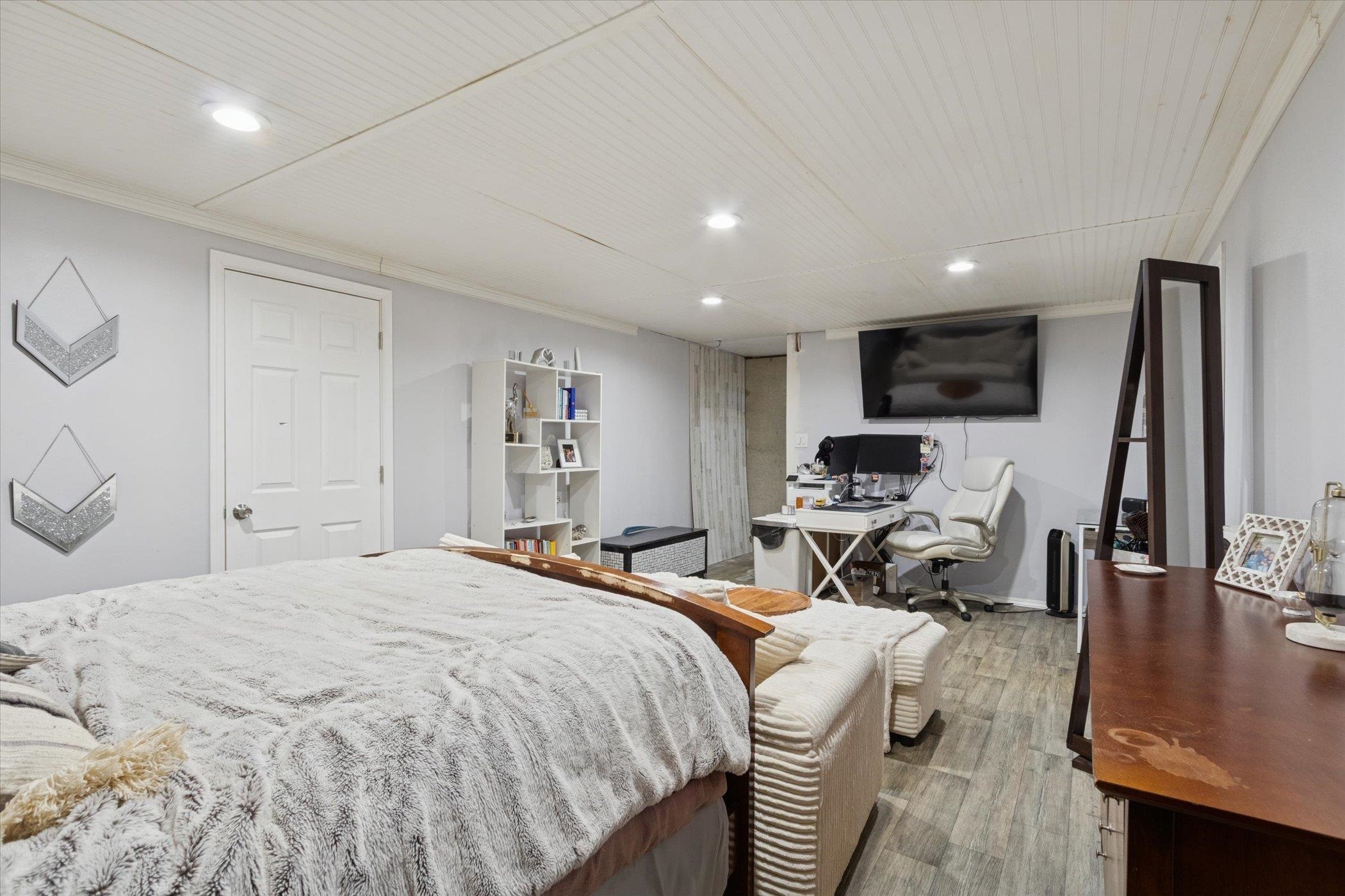 549 Bayfield Road Rockton, IL 61073 - Photo 29 of 47 a bedroom with a bed a couch and a flat screen tv