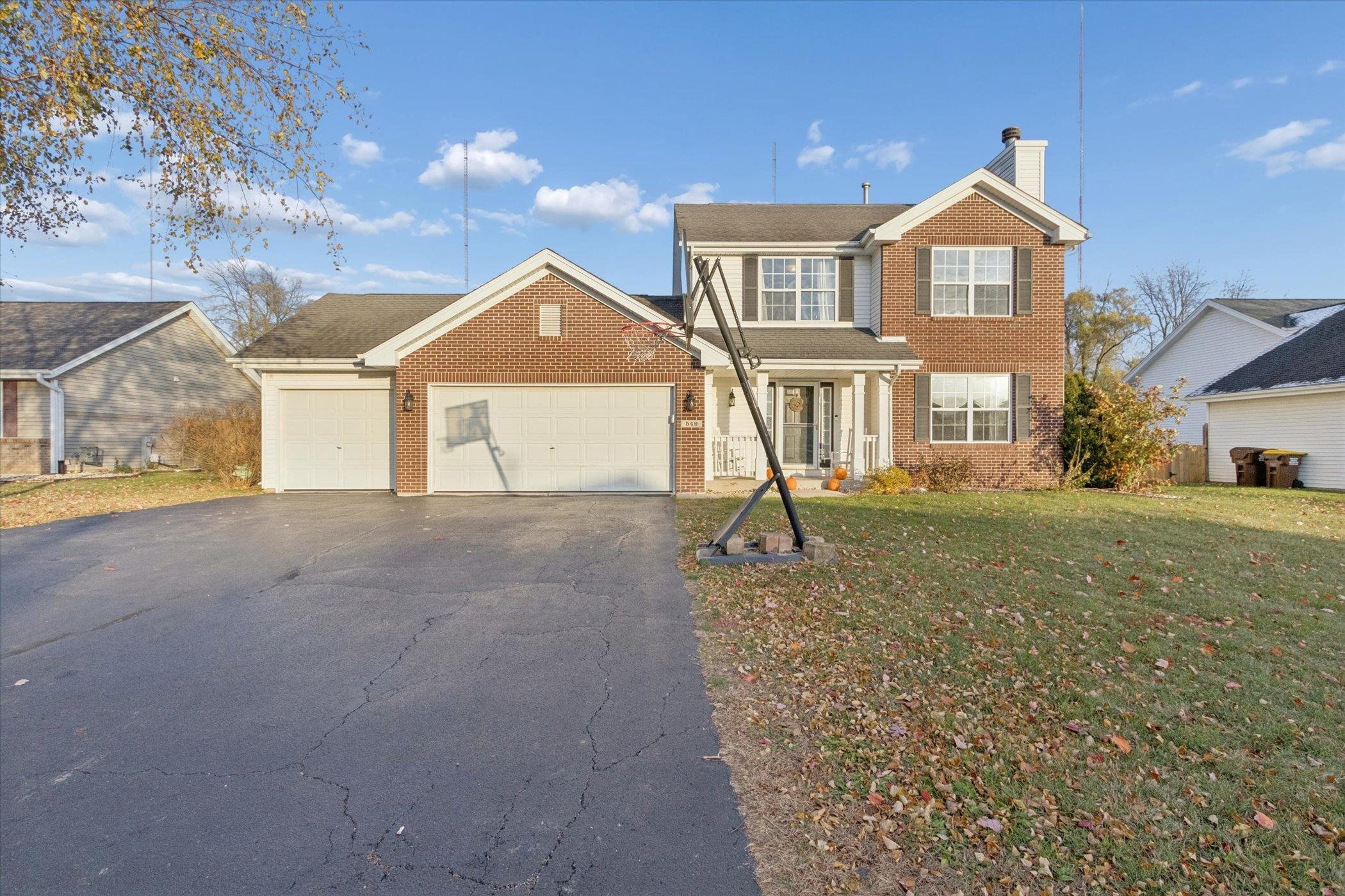549 Bayfield Road Rockton, IL 61073 - Photo 3 of 47 a front view of a house with a yard