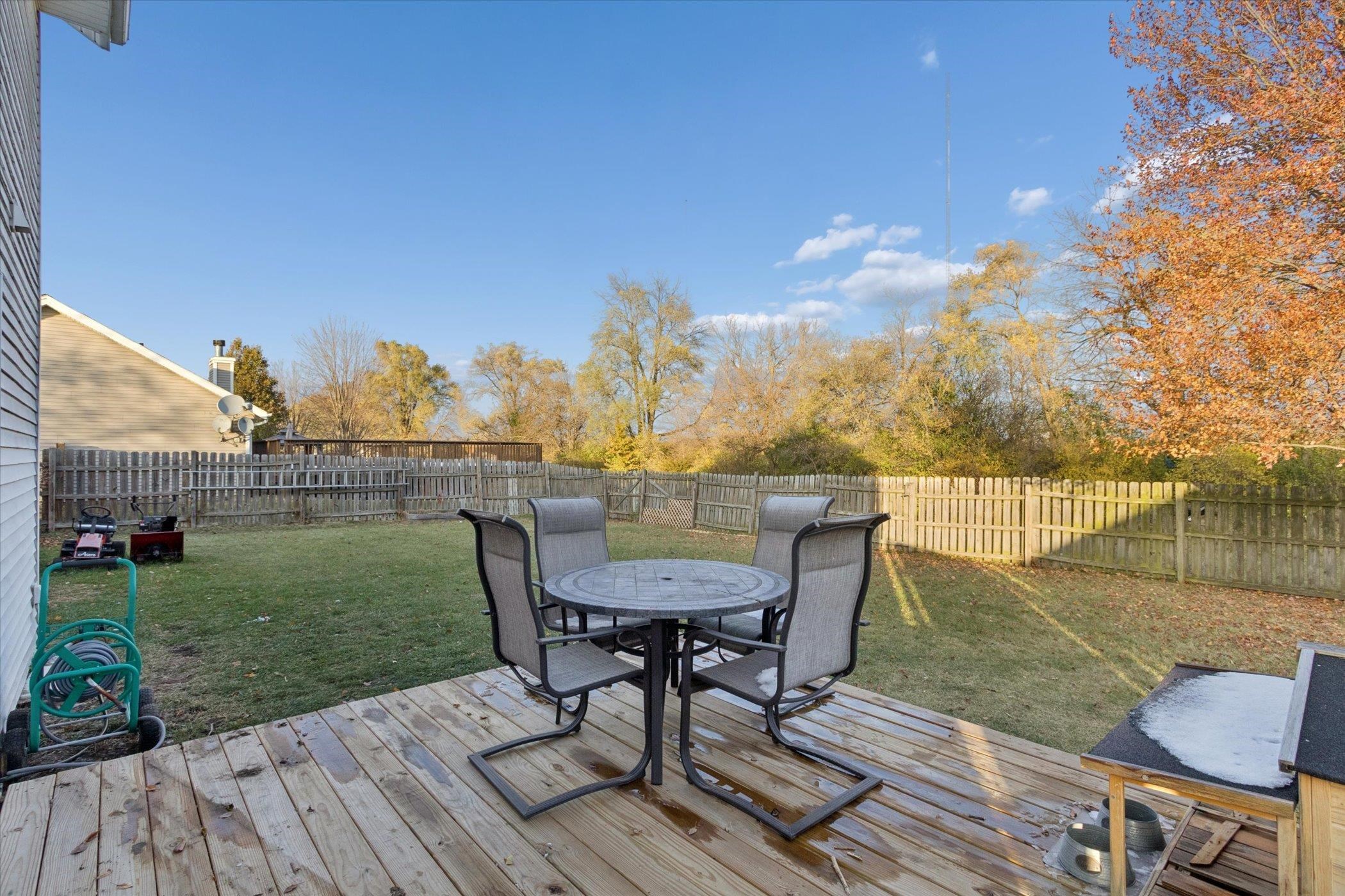549 Bayfield Road Rockton, IL 61073 - Photo 34 of 47 a view of a chairs and table on the deck