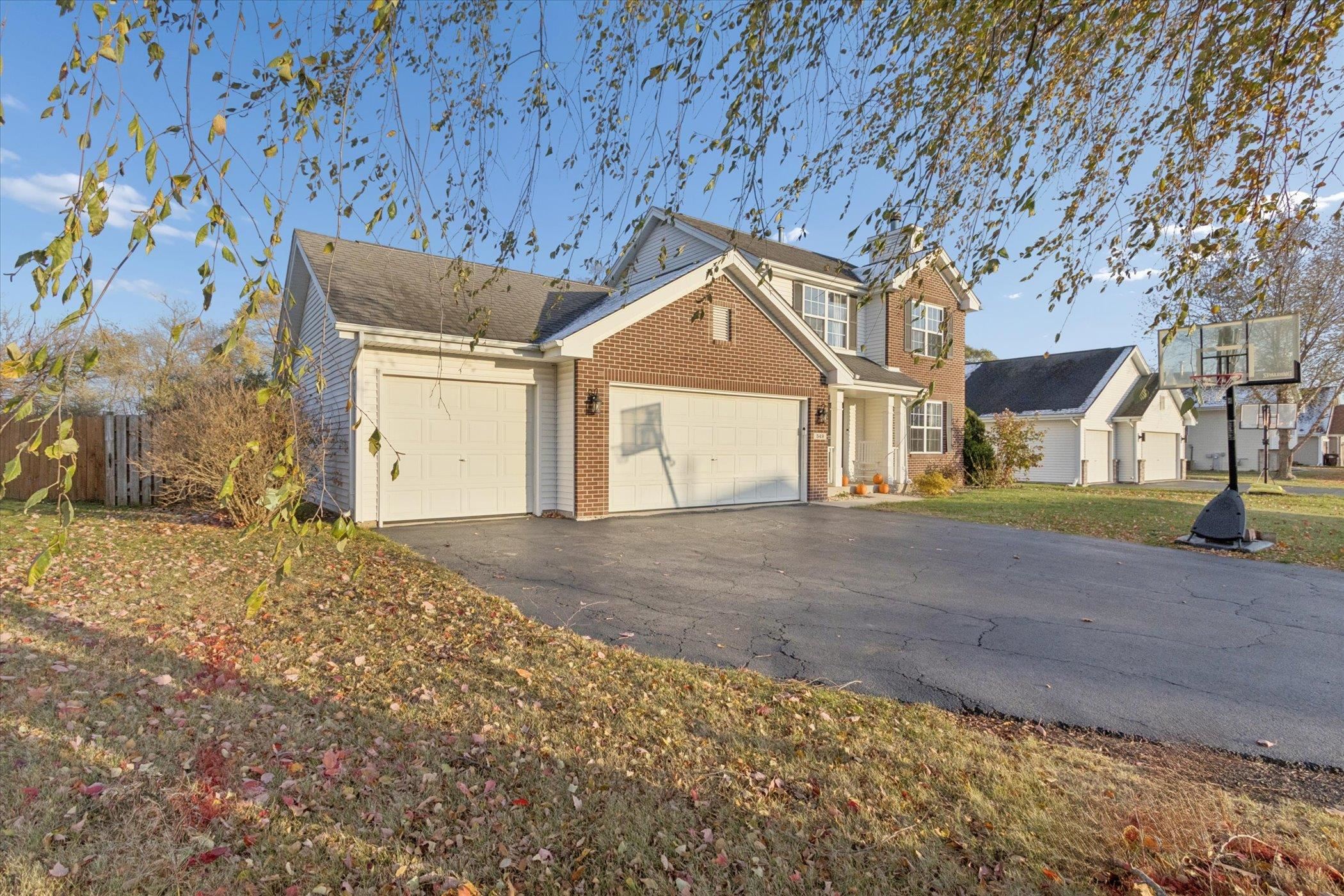 549 Bayfield Road Rockton, IL 61073 - Photo 5 of 47 a front view of a house with a yard and garage