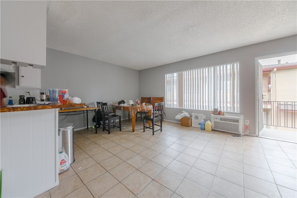 14224 Erwin Street Van Nuys, CA 91401 - Photo 13 of 18 a very nice looking room with a large window and a chandelier