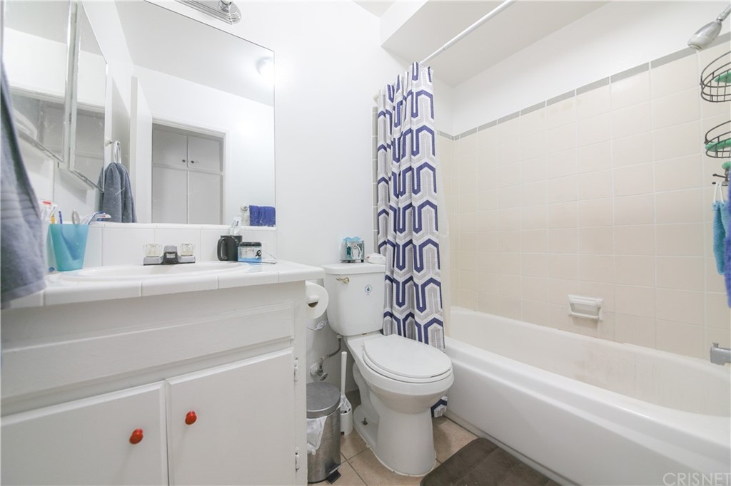 14224 Erwin Street Van Nuys, CA 91401 - Photo 15 of 18 a bathroom with a sink a toilet and a bathtub