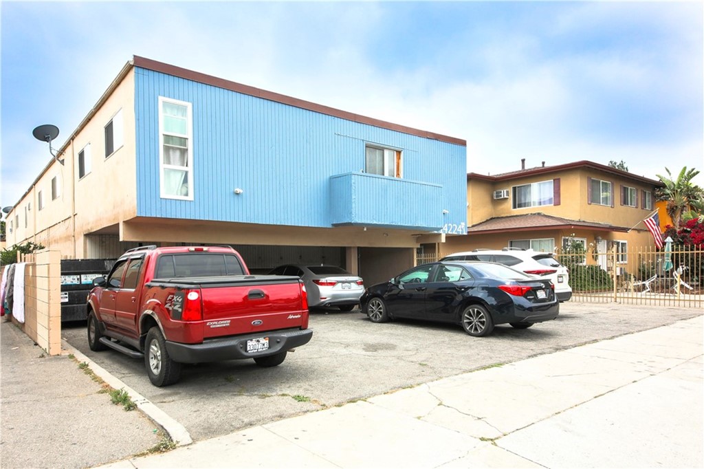14224 Erwin Street Van Nuys, CA 91401 - Photo 5 of 18 a cars parked in front of a house