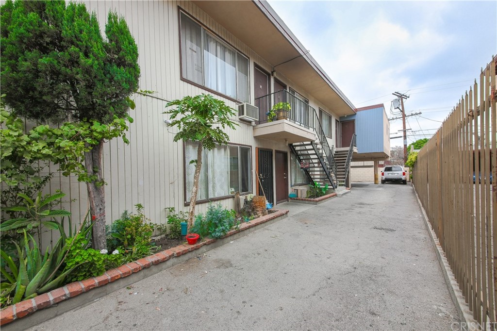 14224 Erwin Street Van Nuys, CA 91401 - Photo 9 of 18 a view of a building with a yard