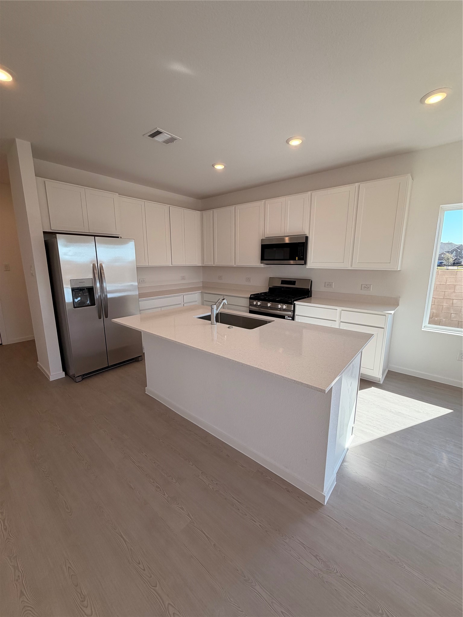 2163 Salinas Drive Rosharon, TX 77583 - Photo 8 of 31 a kitchen with stainless steel appliances granite countertop a sink a stove and a refrigerator