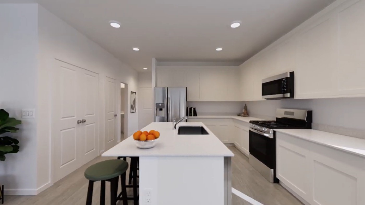 2163 Salinas Drive Rosharon, TX 77583 - Photo 17 of 31 a kitchen that has a sink a microwave a refrigerator and chairs