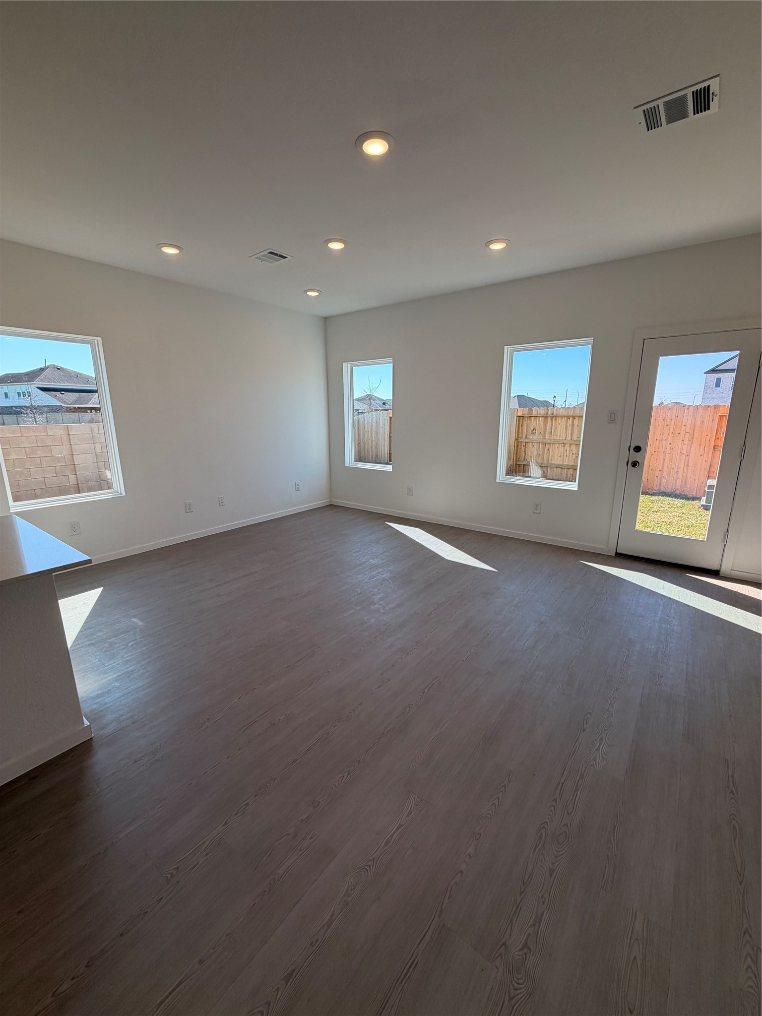 2163 Salinas Drive Rosharon, TX 77583 - Photo 9 of 31 an empty room with windows and fireplace