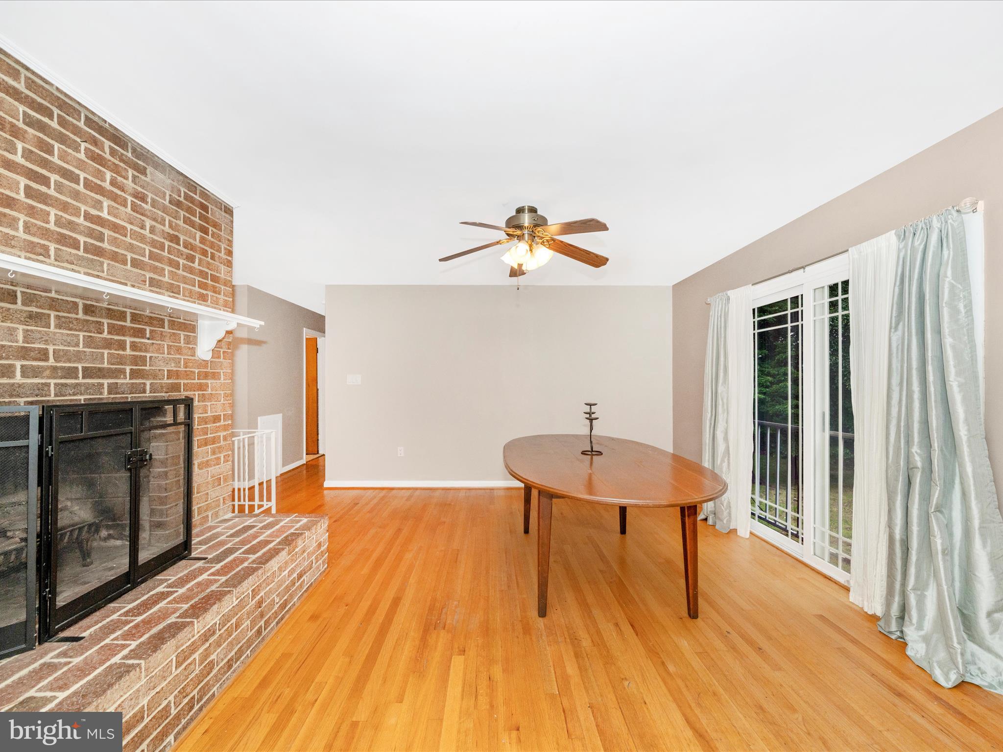 7019 Fitzpatrick Drive Laurel, MD 20707 - Photo 23 of 59 a view of a room with wooden floor windows and fireplace