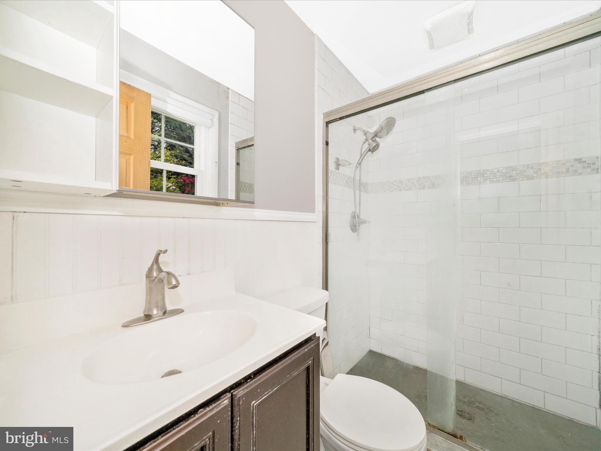 7019 Fitzpatrick Drive Laurel, MD 20707 - Photo 29 of 59 a bathroom with a sink toilet and shower