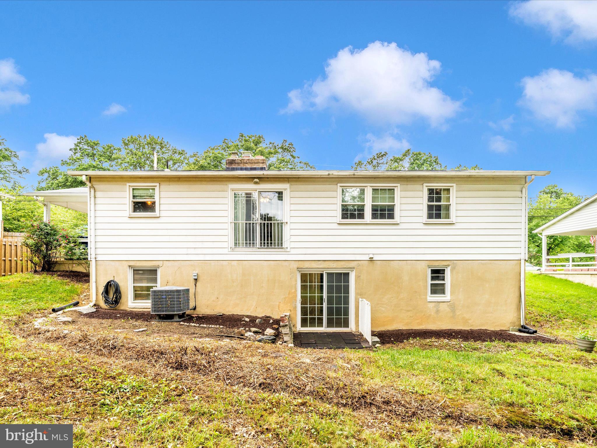 7019 Fitzpatrick Drive Laurel, MD 20707 - Photo 50 of 59 a view of a backyard with a garden and fire pit