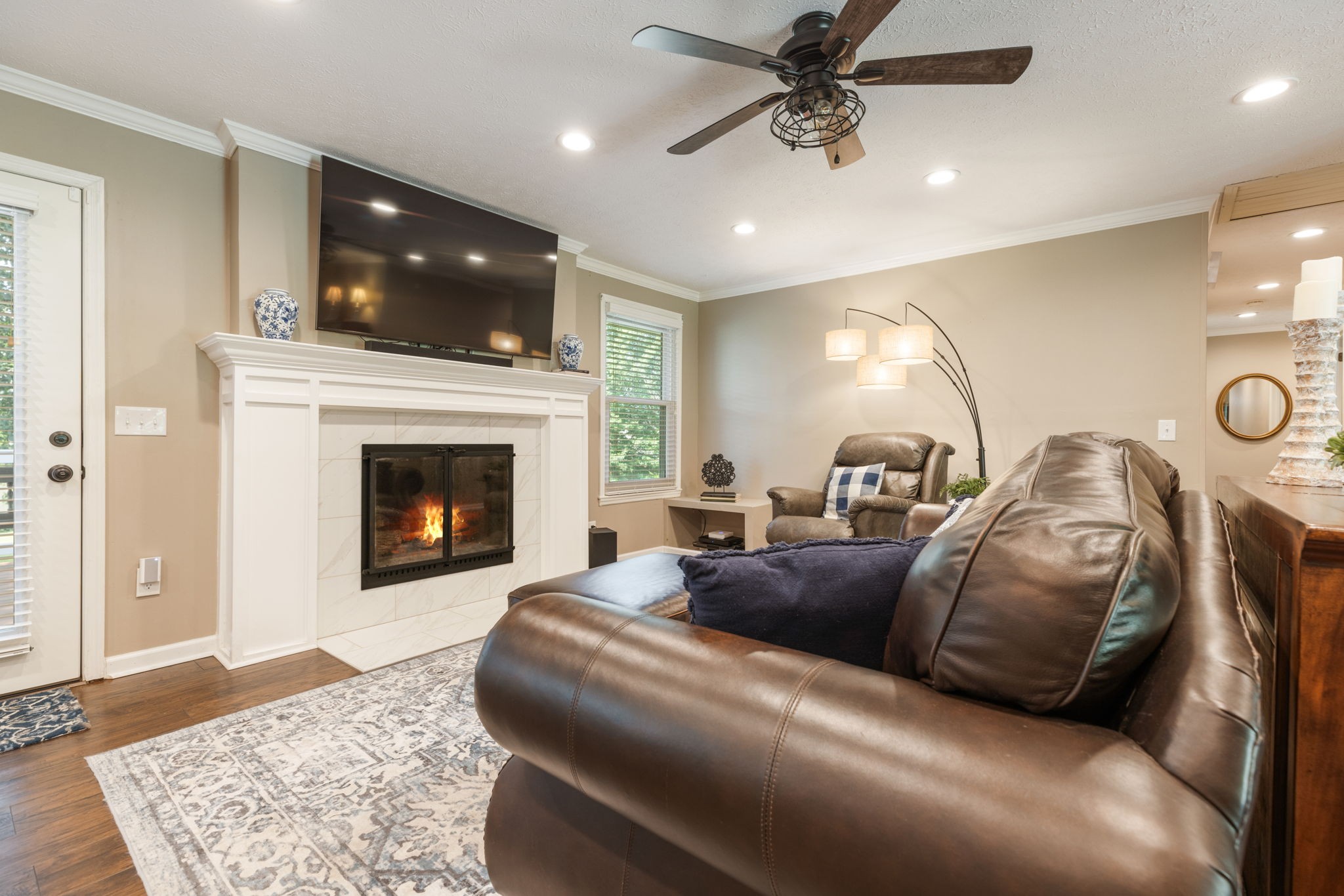 7367 Crow Cut Road Fairview, TN 37062 - Photo 12 of 96 a living room with furniture and a fireplace