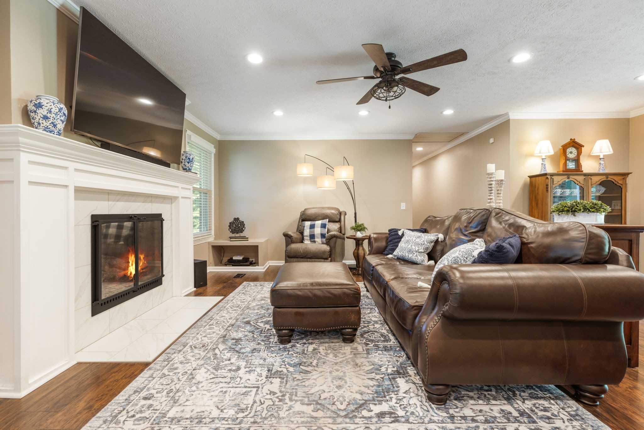 7367 Crow Cut Road Fairview, TN 37062 - Photo 13 of 96 a living room with furniture and a fireplace