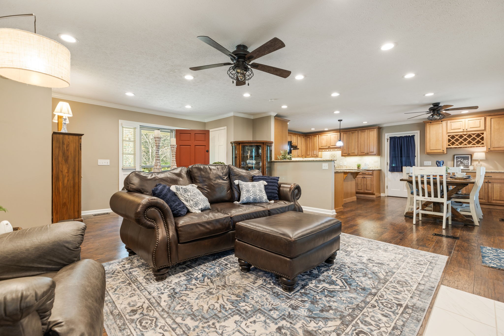 7367 Crow Cut Road Fairview, TN 37062 - Photo 16 of 96 a living room with furniture and a dining table with wooden floor