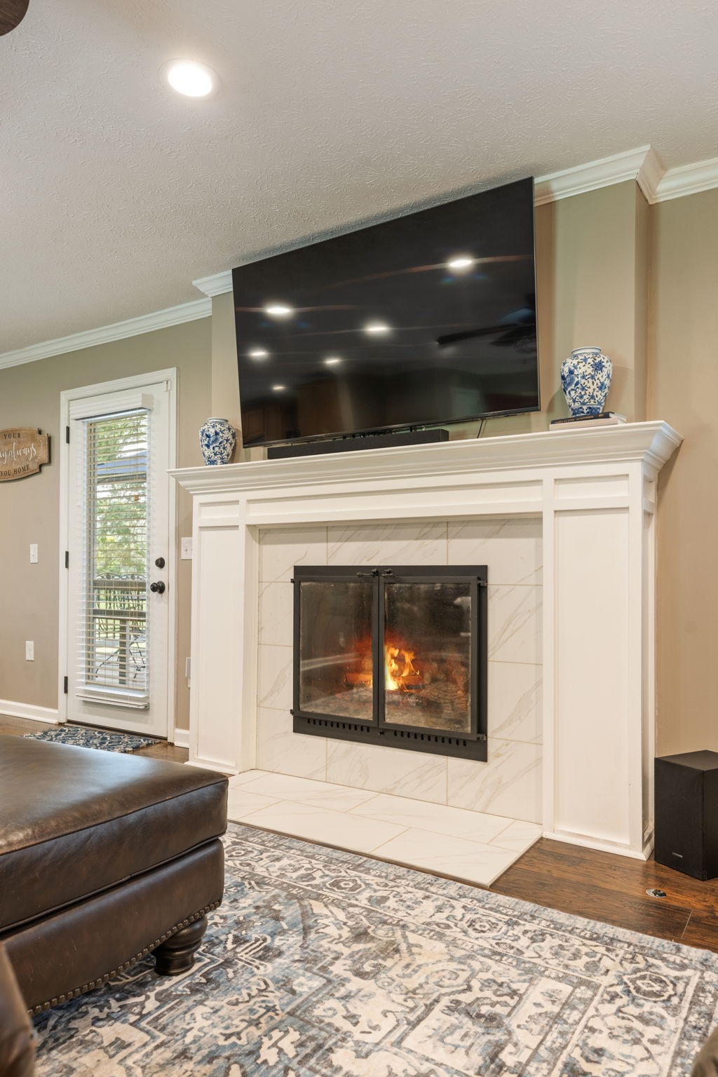 7367 Crow Cut Road Fairview, TN 37062 - Photo 18 of 96 a living room with furniture and a fireplace
