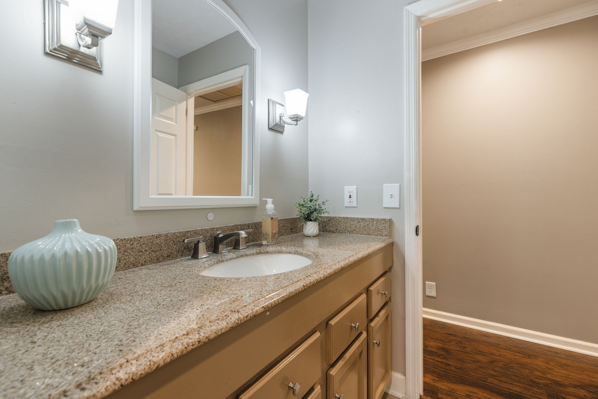 7367 Crow Cut Road Fairview, TN 37062 - Photo 44 of 96 a bathroom with a granite countertop sink and a mirror
