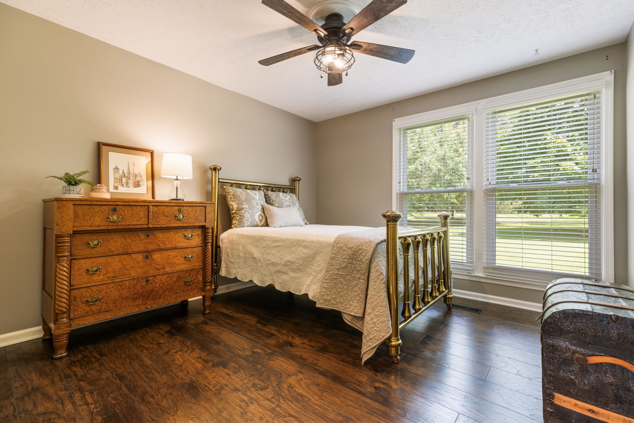 7367 Crow Cut Road Fairview, TN 37062 - Photo 47 of 96 a bedroom with a bed and a chandelier