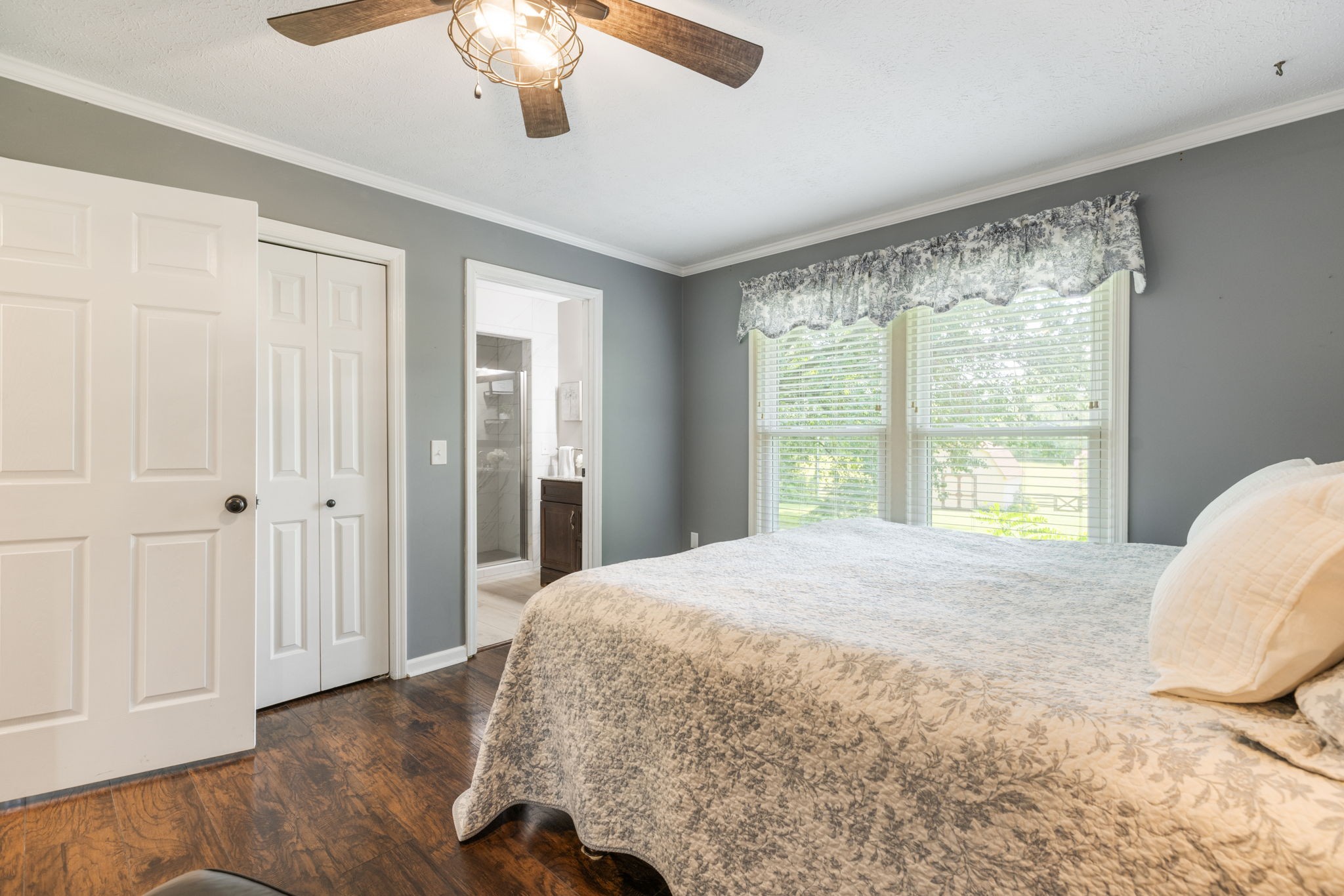 7367 Crow Cut Road Fairview, TN 37062 - Photo 51 of 96 a bedroom with a large bed and a window
